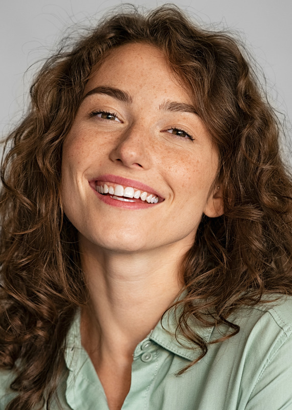 Photo of a brunette woman with freckles